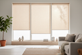 Light filtering roller shades in natural linen in a bright modern living room